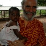 Dada Daneshananda and a baby who was born free from HIV